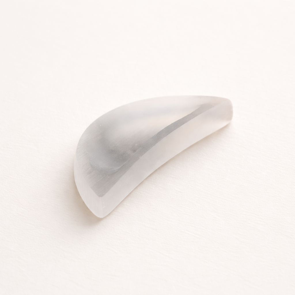 White selenite moon-shaped crystal charging bowl for cleansing jewelry and stones