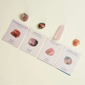 Four cards with crystal names and images on a light background